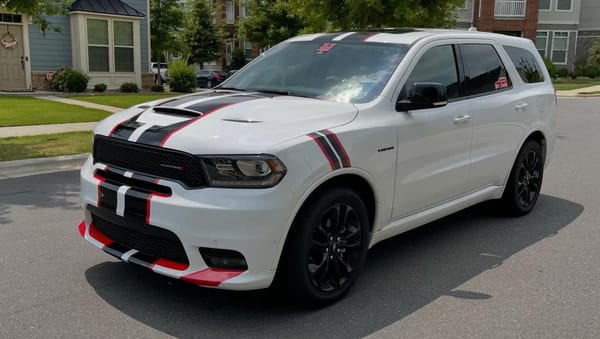 White Dodge Durango with red and black rally stripes