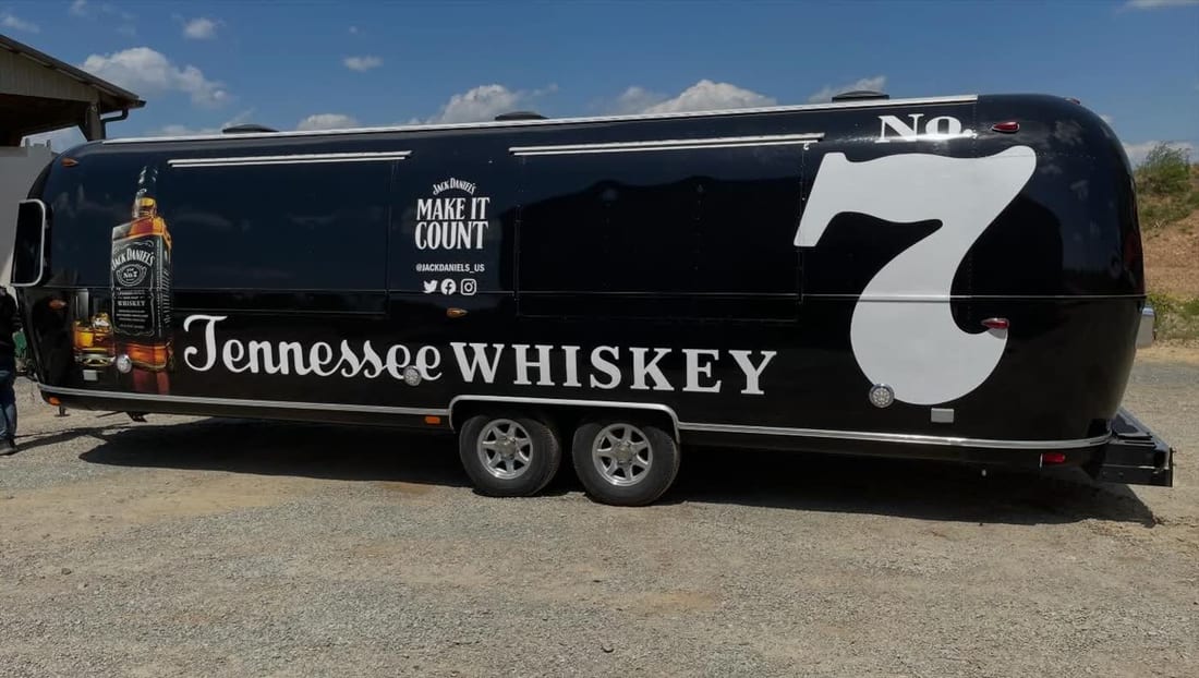 Concession trailer fully wrapped in a Tennessee Whiskey brand design